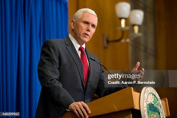 Indiana Gov. Mike Pence speaks during a press conference March 31, 2015 at the Indiana State Library in Indianapolis, Indiana. Pence spoke about the...