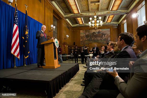 Indiana Gov. Mike Pence speaks during a press conference March 31, 2015 at the Indiana State Library in Indianapolis, Indiana. Pence spoke about the...