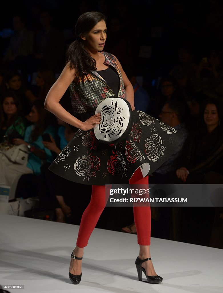 A model presents a creation by designers Madiha Raza at the Fashion ...
