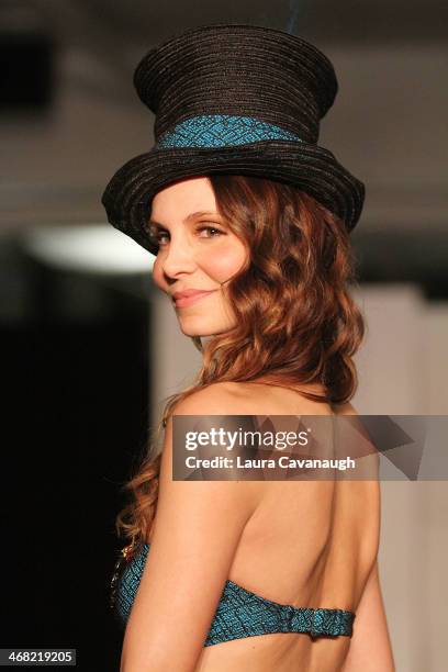 Model walks the runway wearing Caitlin Kelly design at the Hairshion fashion show during Mercedes-Benz Fashion Week Fall 2014 at Alvin Alley Studios...