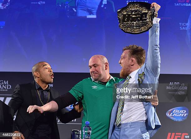 Featherweight title challenger Conor 'The Notorious' McGregor steals UFC Featherweight Champion Jose Aldo's belt as UFC President Dana White...