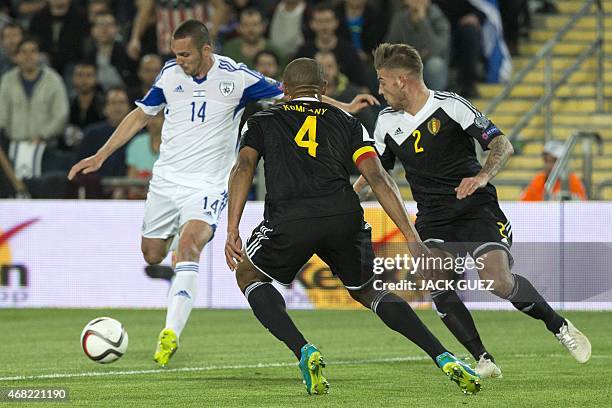 Israel's forward Ben Sahar vies with Belgium's defender Vincent Kompany during their Euro 2016 qualifying football match match between Israel and...