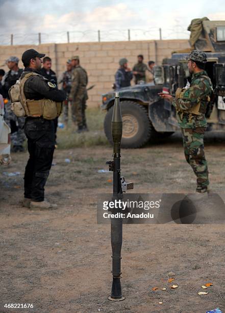 Iraqi security forces and Shiite militas are seen as they rest during an operation against Daesh terrorist to capture the city, in Tikrit, Iraq on...
