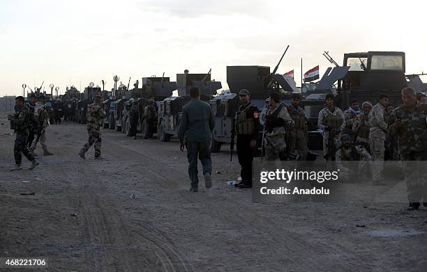 Iraqi security forces and Shiite militas are seen as they rest during an operation against Daesh terrorist to capture the city, in Tikrit, Iraq on...