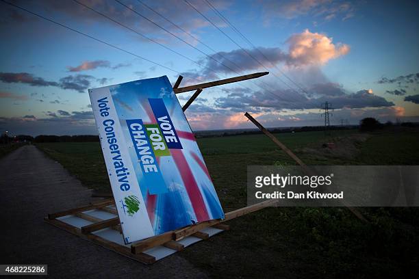 Conservative election billboard is blown over in high winds in a field on March 31, 2015 near Ramsgate, United Kingdom.