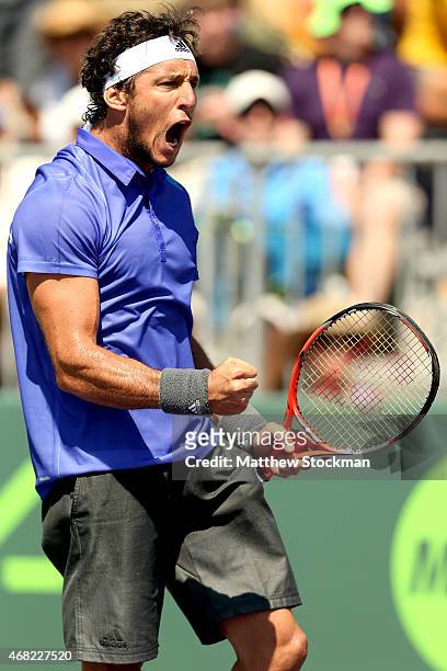 Juan Monaco of Argentina celebrates match point against Fernando Verdasco of Spain during day 9 of the Miami Open Presented by Itau at Crandon Park...