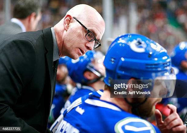 Video coach Darryl Williams of the Vancouver Canucks talks to players on the bench during their NHL game against the Phoenix Coyotes at Rogers Arena...