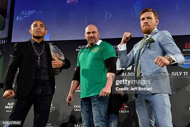 President Dana White separates UFC Featherweight Champion Jose Aldo of Brazil and title challenger Conor 'The Notorious' McGregor of Ireland as they...