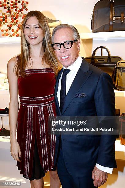 Model Behati Prinsloo and Tommy Hilfiger attend the Tommy Hilfiger Boutique Opening at Boulevard Capucines on March 31, 2015 in Paris, France.