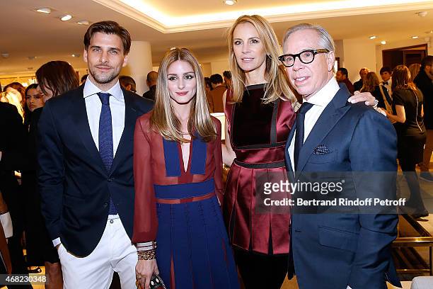 Olivia Palermo with her husband Johnnes Huebel and Tommy Hilfiger with his wife Dee attend the Tommy Hilfiger Boutique Opening at Boulevard Capucines...