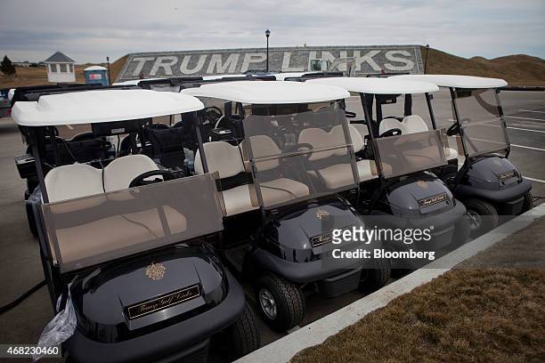Golf carts prepared for opening day sit at the Trump Links golf course in the Bronx borough of New York, U.S., on Tuesday, March 31, 2015. The...