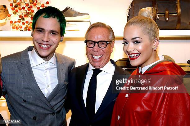 Tommy Hilfiger standing between his son Richard Hilfiger and Singer Rita Ora attend the Tommy Hilfiger Boutique Opening at Boulevard Capucines on...