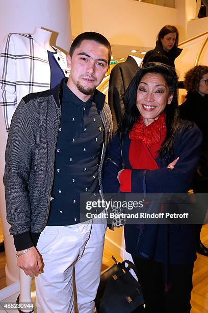 Ysabelle Lacamp and her son Caspar attend the Tommy Hilfiger Boutique Opening at Boulevard Capucines on March 31, 2015 in Paris, France.