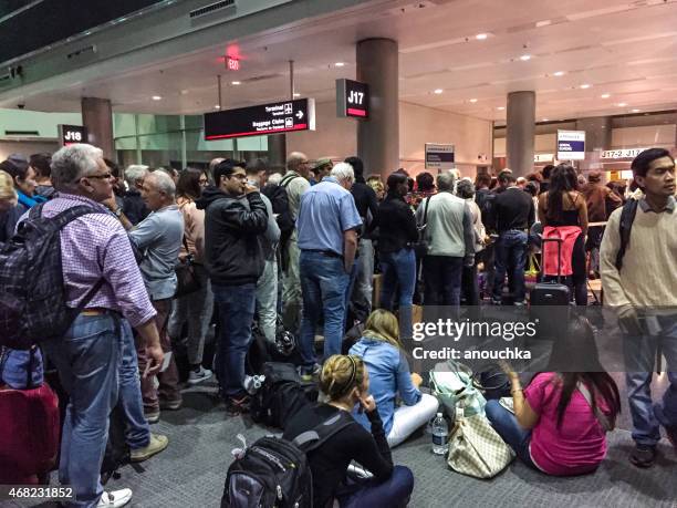 passengers waiting for boarding, miami airport - crowded airport stock pictures, royalty-free photos & images