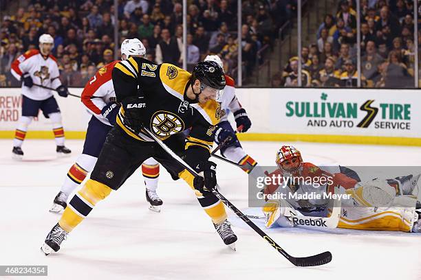 Loui Eriksson of the Boston Bruins scores a goal against Roberto Luongo of the Florida Panthers during the first period at TD Garden on March 31,...