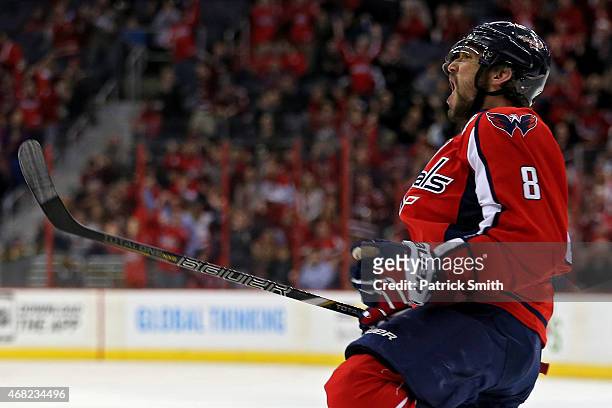 Alex Ovechkin of the Washington Capitals celebrates after scoring a goal against the Carolina Hurricanes in the first period at Verizon Center on...