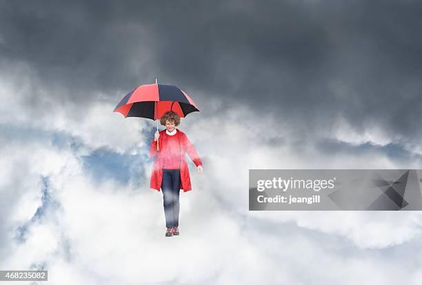 frau vor dem sturm, fallen durch den himmel  - woman filling out paperwork stock-fotos und bilder