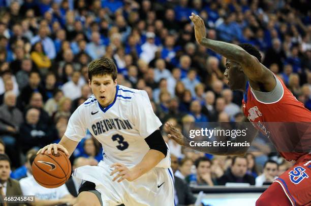 Doug McDermott of the Creighton Bluejays moves around Jakarr Sampson of the St. John's Red Storm during their game at CenturyLink Center on January...