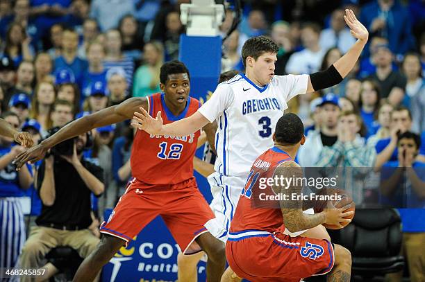 Doug McDermott of the Creighton Bluejays guards D'Angelo Harrison of the St. John's Red Storm during their game at CenturyLink Center on January 28,...