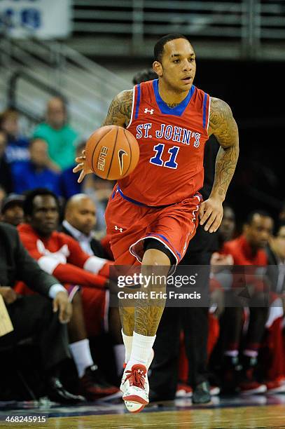 Angelo Harrison of the St. John's Red Storm brings the ball up court during their game against the Creighton Bluejays at CenturyLink Center on...