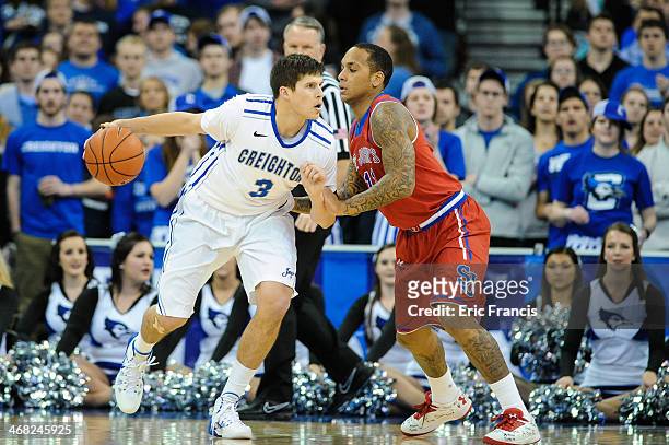 Angelo Harrison of the St. John's Red Storm guards Doug McDermott of the Creighton Bluejays during their game at CenturyLink Center on January 28,...