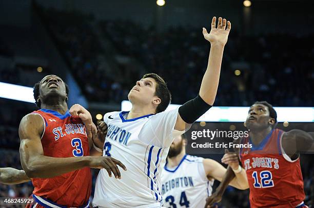 God'sgift Achiuwa of the St. John's Red Storm and Doug McDermott of the Creighton Bluejays battle for position during their game at CenturyLink...