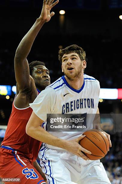 Will Artino of the Creighton Bluejays drives to the basket past Chris Obekpa of the St. John's Red Storm during their game at CenturyLink Center on...