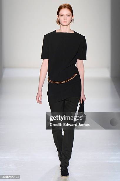 Model walks the runway at the Victoria Beckham show during Mercedes-Benz Fashion Week Fall 2014 at Cafe Rouge on February 9, 2014 in New York City.