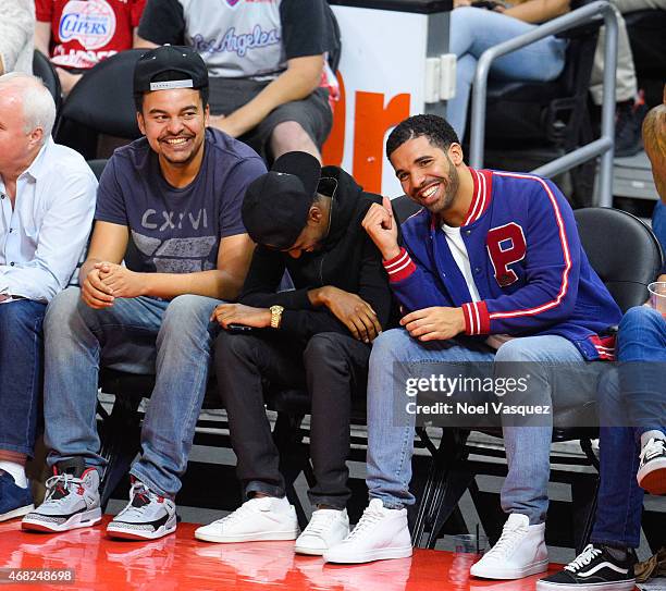 Drake and Alex da Kid attend a basketball game between the Golden State Warriors and the Los Angeles Clippers at Staples Center on March 31, 2015 in...