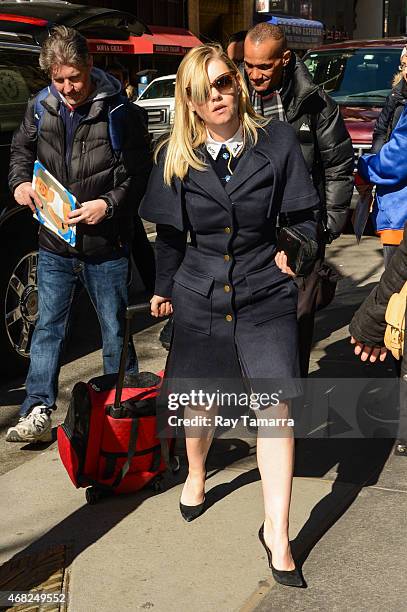 Actress Elisha Cuthbert enters the "Today Show" taping at the NBC Rockefeller Center Studios on March 31, 2015 in New York City.