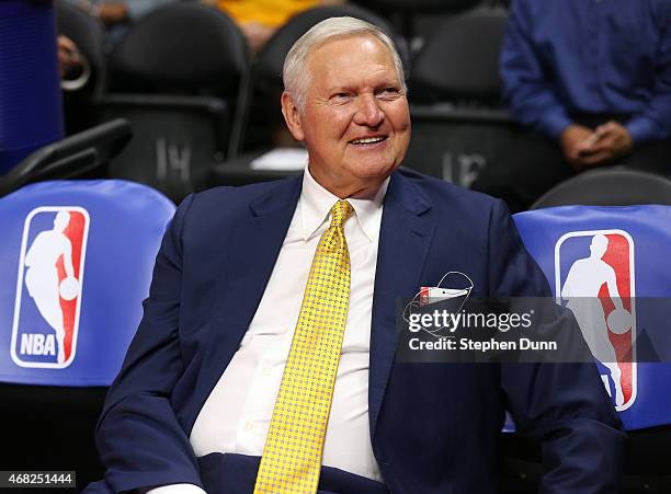 Golden State Warriors executive board member Jerry West sits on the bench by NBA logos before the game the Los Angeles Clippers at Staples Center on...