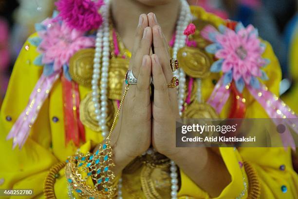 Sang Long', an ethnic Tai Yai boy performs a traditional rite during the Poy Sang Long festival at Wat Jong Kham. Poy Sang Long is a Buddhist novice...