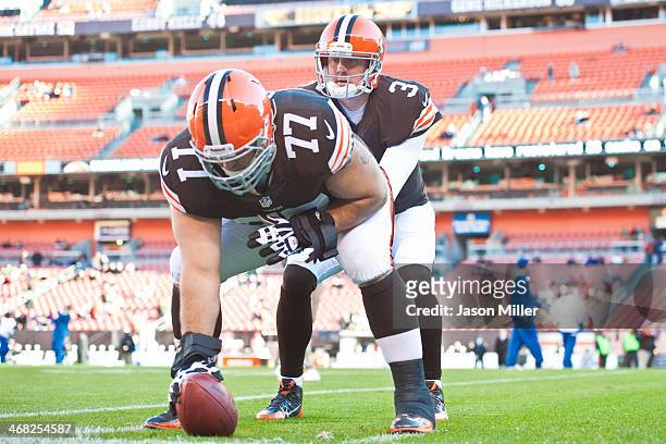 Guard John Greco and quarterback Brandon Weeden of the Cleveland Browns warm up prior to the game against the Baltimore Ravens at FirstEnergy Stadium...