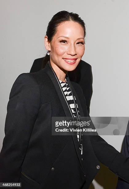 Lucy Liu poses backstage at the Edun show during Mercedes-Benz Fashion Week Fall 2014 at Skylight Modern on February 9, 2014 in New York City.