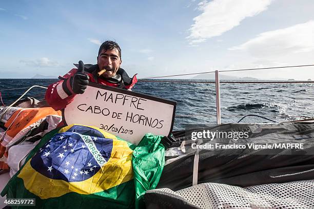 In this handout image provided by the Volvo Ocean Race, Leg 5 to Itajai onboard MAPFRE. Rounding Cape Horn. Andre Fonseca, aka Bochecha, celebrates...