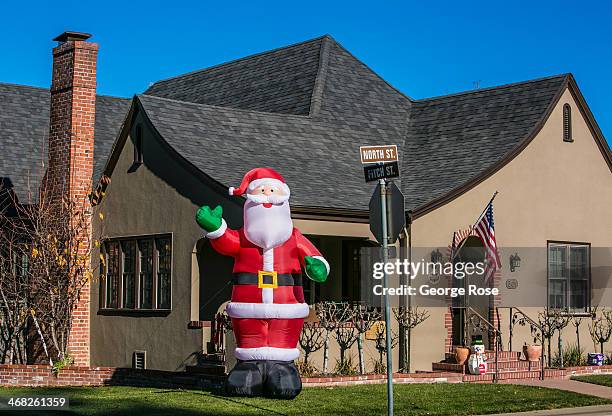 Large inflatable Santa Claus adorns one of the front yards of this buccolic Wine Country destination on December 25 near Healdsburg, California. With...