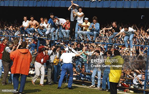 Derby County Manager Arthur Cox celebrates promotion with fans after a Today League Division Two match against Plymouth at the Baseball Ground in...