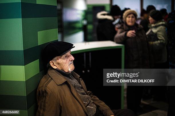 Man waits to receive his pension paid in Russian ruble notes in the eastern Ukrainian city of Donetsk on April 1, 2015. The year-long conflict in...