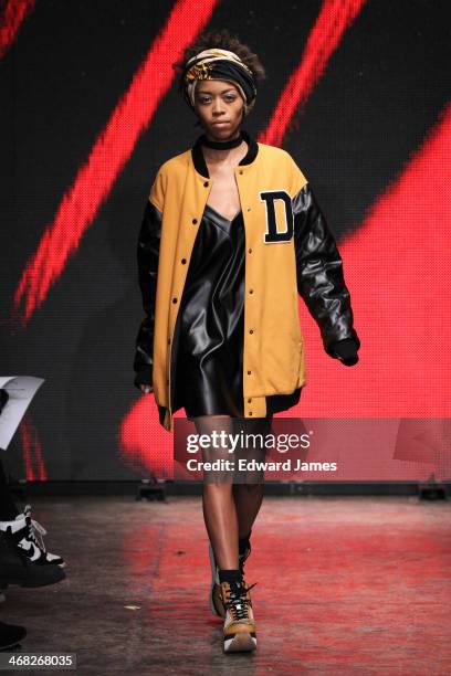 Model walks the runway at DKNY Women's during Mercedes-Benz Fashion Week Fall 2014 at 547 West 26th Street on February 9, 2014 in New York City.