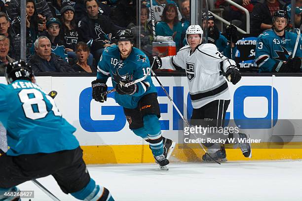 Andrew Desjardins of the San Jose Sharks skates against Colin Fraser of the Los Angeles Kings at SAP Center on January 27, 2014 in San Jose,...