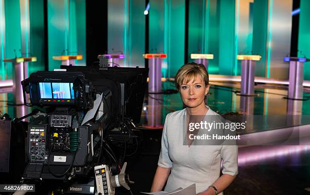 In this handout provided by ITV, Julie Etchingham prepares in front of the seven lecterns set up for : Green Party leader Natalie Bennett, Liberal...