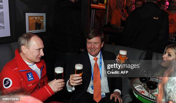 Russia's President Vladimir Putin speaks with King Willem-Alexander of the Netherlands and Queen Maxima during Putin's visit to the Holland Heineken...