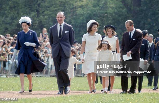 Queen Elizabeth II and Prince Philip walking with Jaqueline Kennedy, her daughter Caroline and John F Kennedy Junior , on the occasion of the...