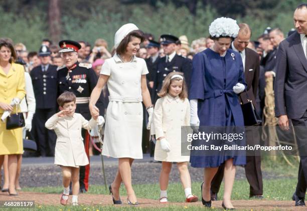 Foreground, left to right, John F Kennedy Junior, Jacqueline Kennedy, Caroline Kennedy, Queen Elizabeth II and Prince Philip on the occasion of the...