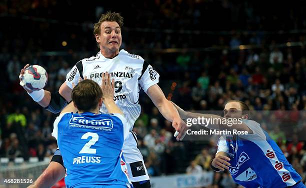 Filip Jicha of Kiel challenges for the ball with Moritz Preuss of Bergischer HC during the DKB HBL Bundesliga match between THW Kiel and Bergischer...