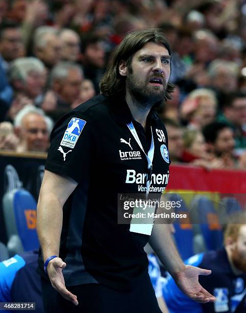 Sebastian Hinze, head coach of Bergischer HC reacts during the DKB HBL Bundesliga match between THW Kiel and Bergischer HC at Sparkassen Arena on...