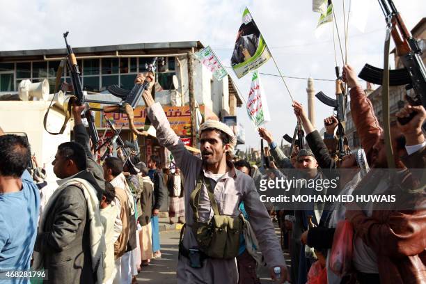 Tribal gunmen loyal to the Huthi movement brandish their weapons in the capital Sanaa on April 1 during a demonstration against Saudi-led coalition's...