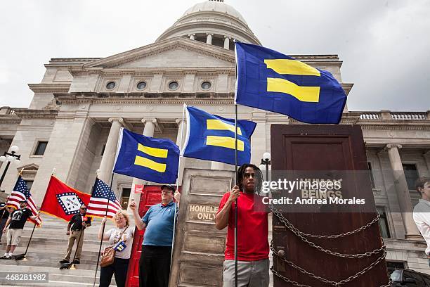 Demonstrators with the Human Rights Campaign set up outside the Arkansas State Capital in Little Rock following Gov. Asa Hutchinson's comments on...