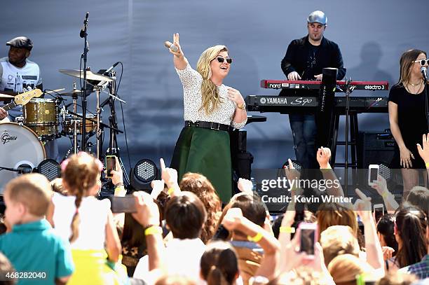 Singer Kelly Clarkson performs onstage for Chevrolet's Best Day Ever with iHeartRadio at The Grove on April 1, 2015 in Los Angeles, California.