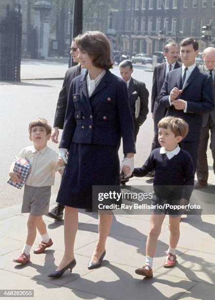 Left to right, John F Kennedy Junior, son of the late United States president, Jacqueline Kennedy, the president's widow, and Anthony Radziwill, her...